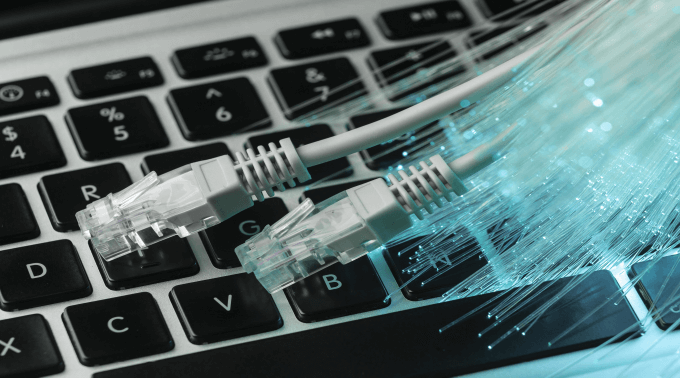 blue-optic-fiber-with-ethernet-cables-laptop